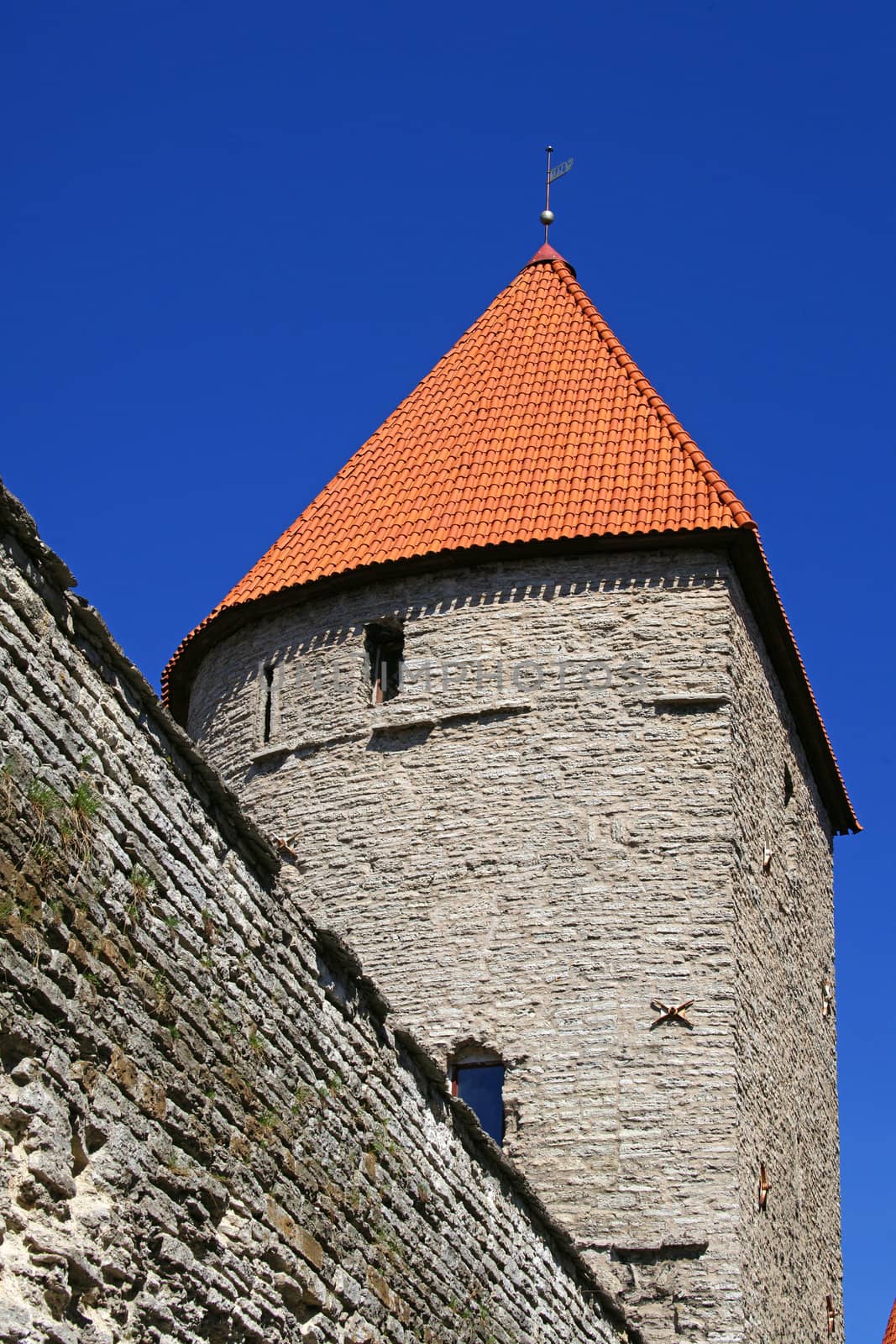 Wall and tower on a background of the blue sky