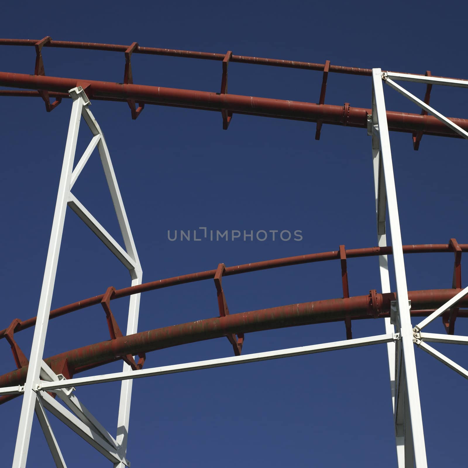 amusement park ride against blue sky