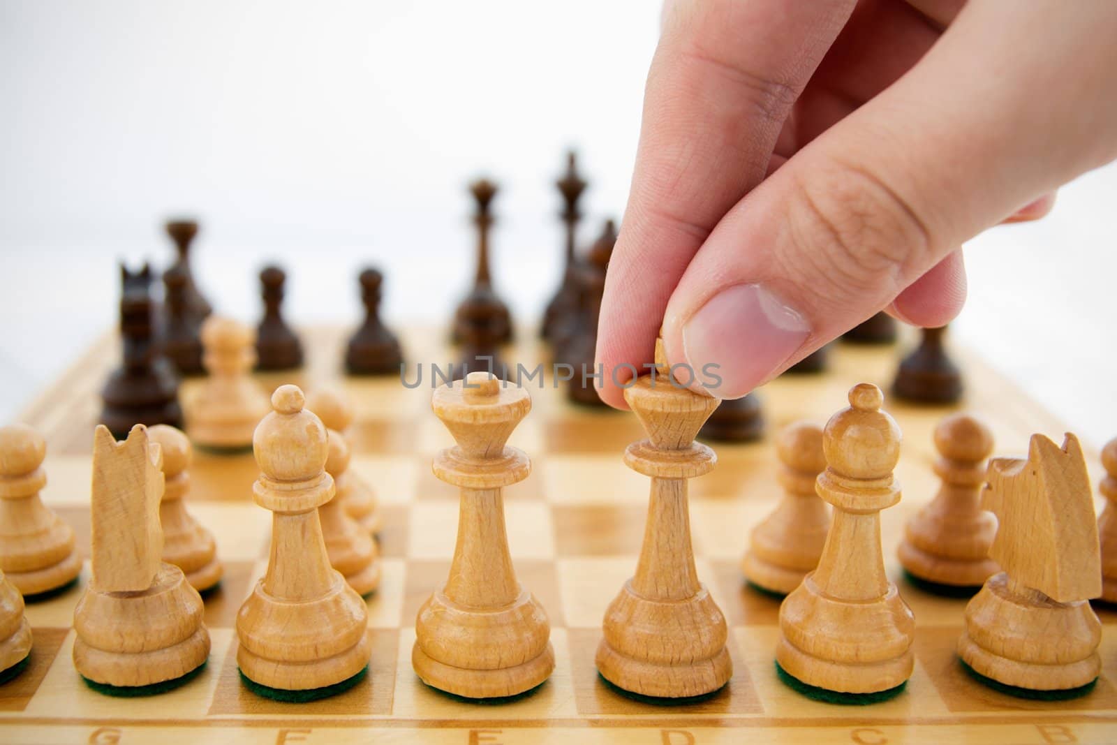 Man playing chess on white background by simpson33