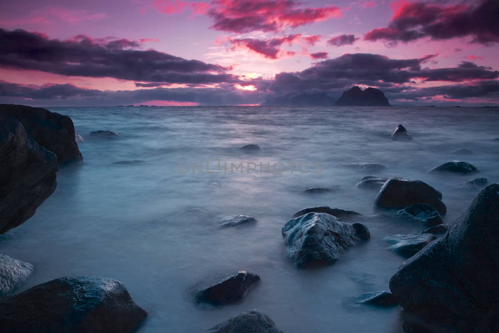 Late night midnight sun by the sea on Lofoten islands in Norway