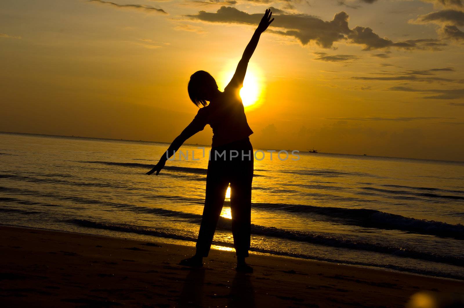 silhouette of woman Yoga on the beach