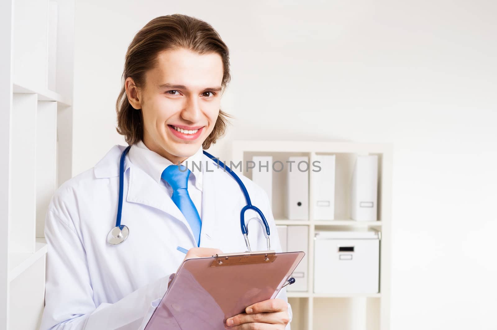 portrait of a doctor with a clipboard takes notes