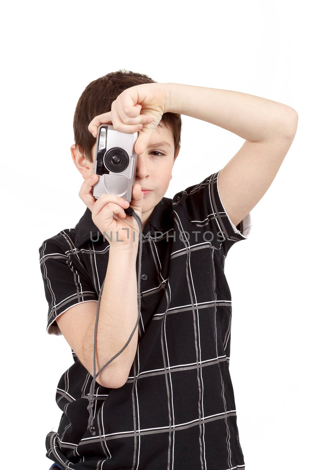small boy photographing vertical with digital camera on white background