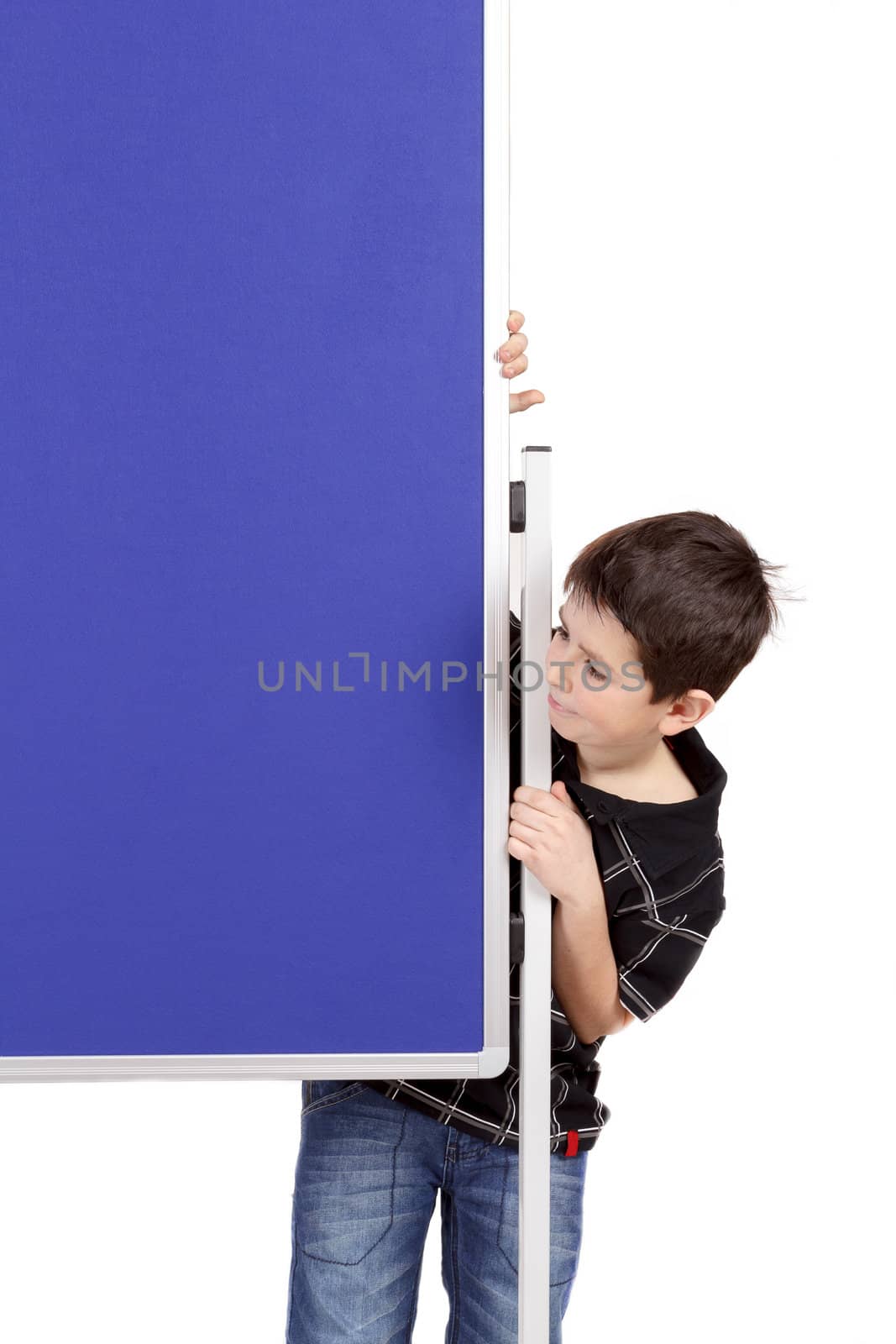 Portrait of happy little boy with blue blank board isolated on white background