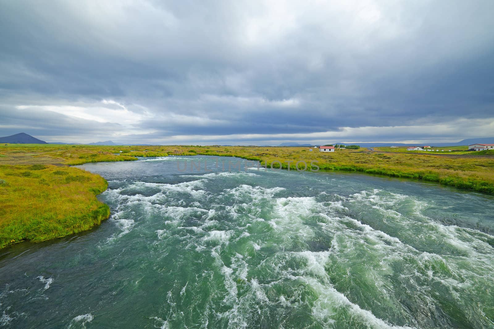 Summer Iceland landscape with big mountain river.