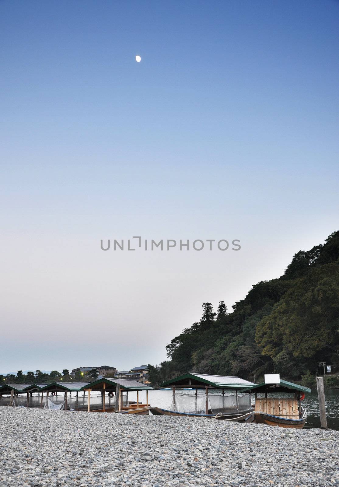 Boats on Katsura river at autumn in Arashiyama, Kyoto, Japan 