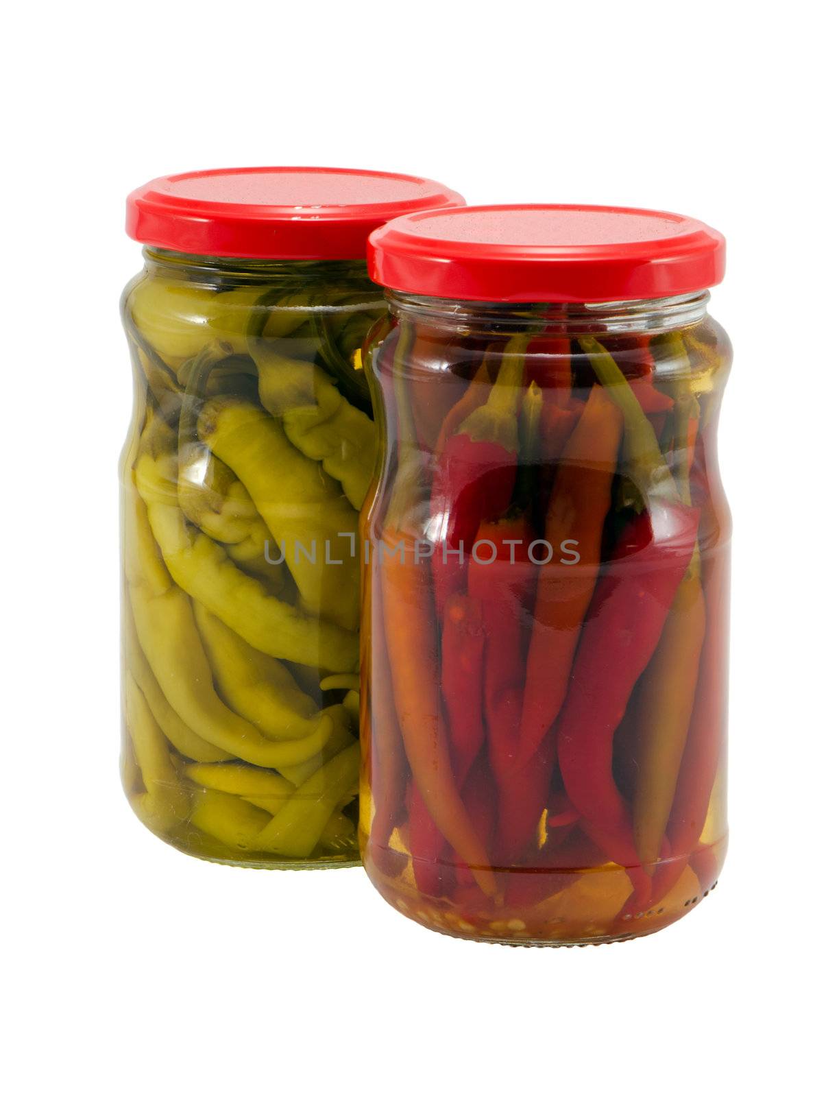 Ecologic chilli peppers paprika preserved in glass pots isolated on white background. Healthy natural food. Resource for winter time.