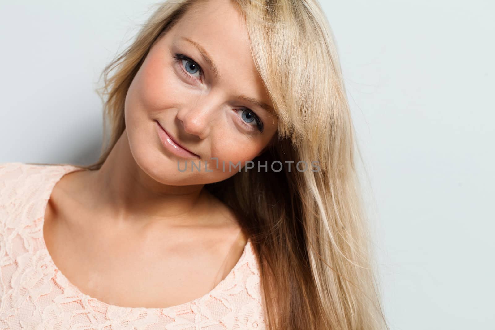 Young attractive woman posing isolated over white background