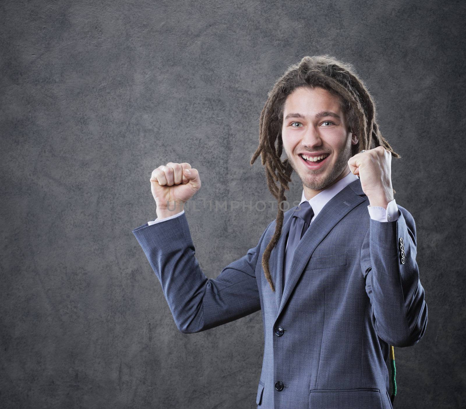 Young business man celebrates success