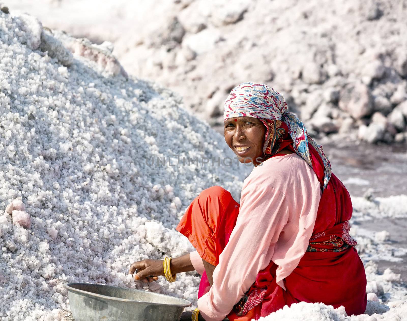 SAMBHAR LAKE TOWN-NOVEMBER 19: An unidentified Indian woman working on the salt farm, November 19, 2012, in Sambhar lake town, Sambhar salt lake, Rajasthan, India