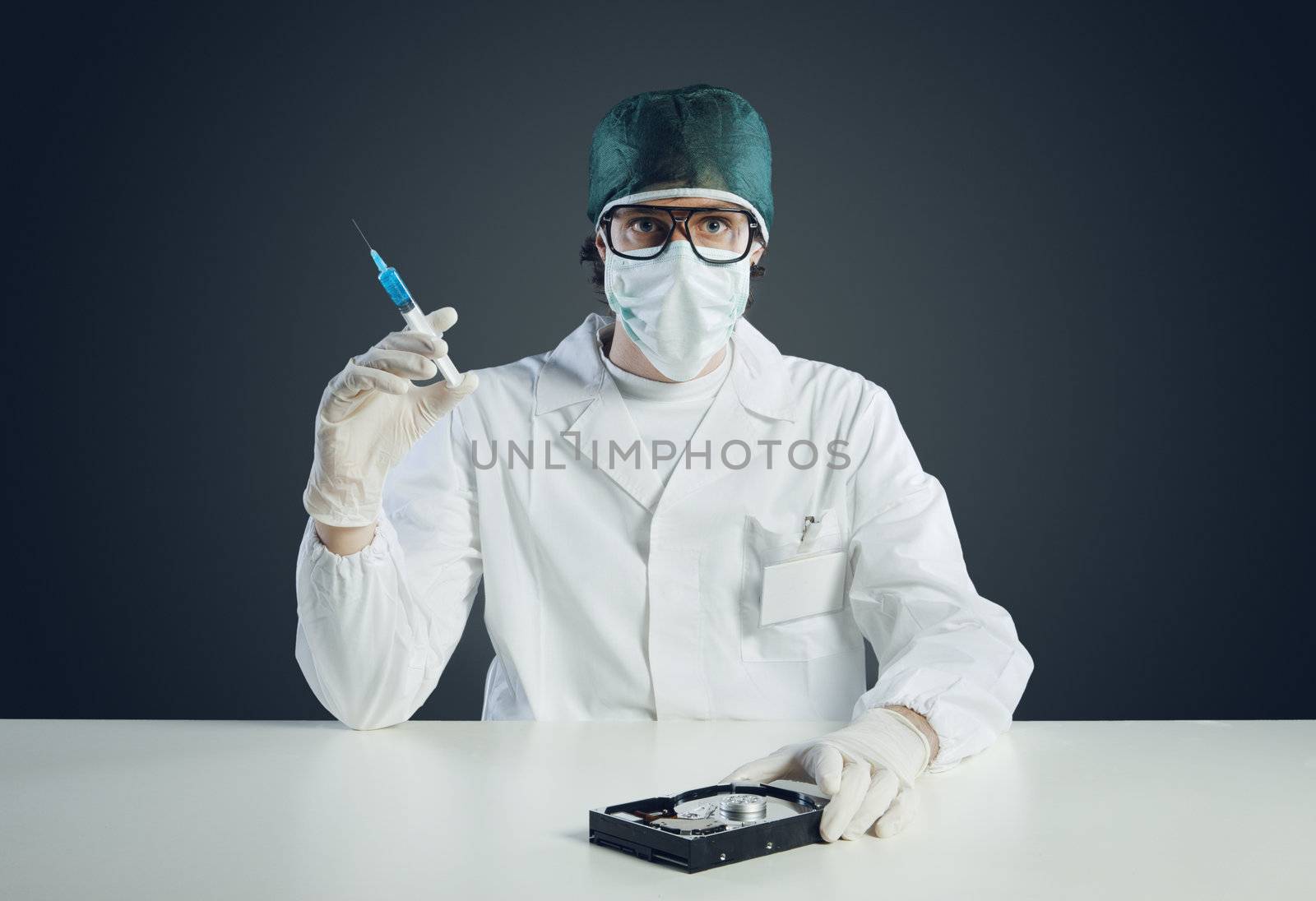 Computer virus concept. Technical / Doctor with syringe and hard disk