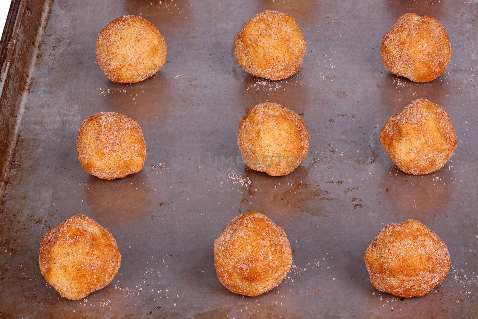 Balls of dough for snickerdoodle cookies on a pan ready to be baked