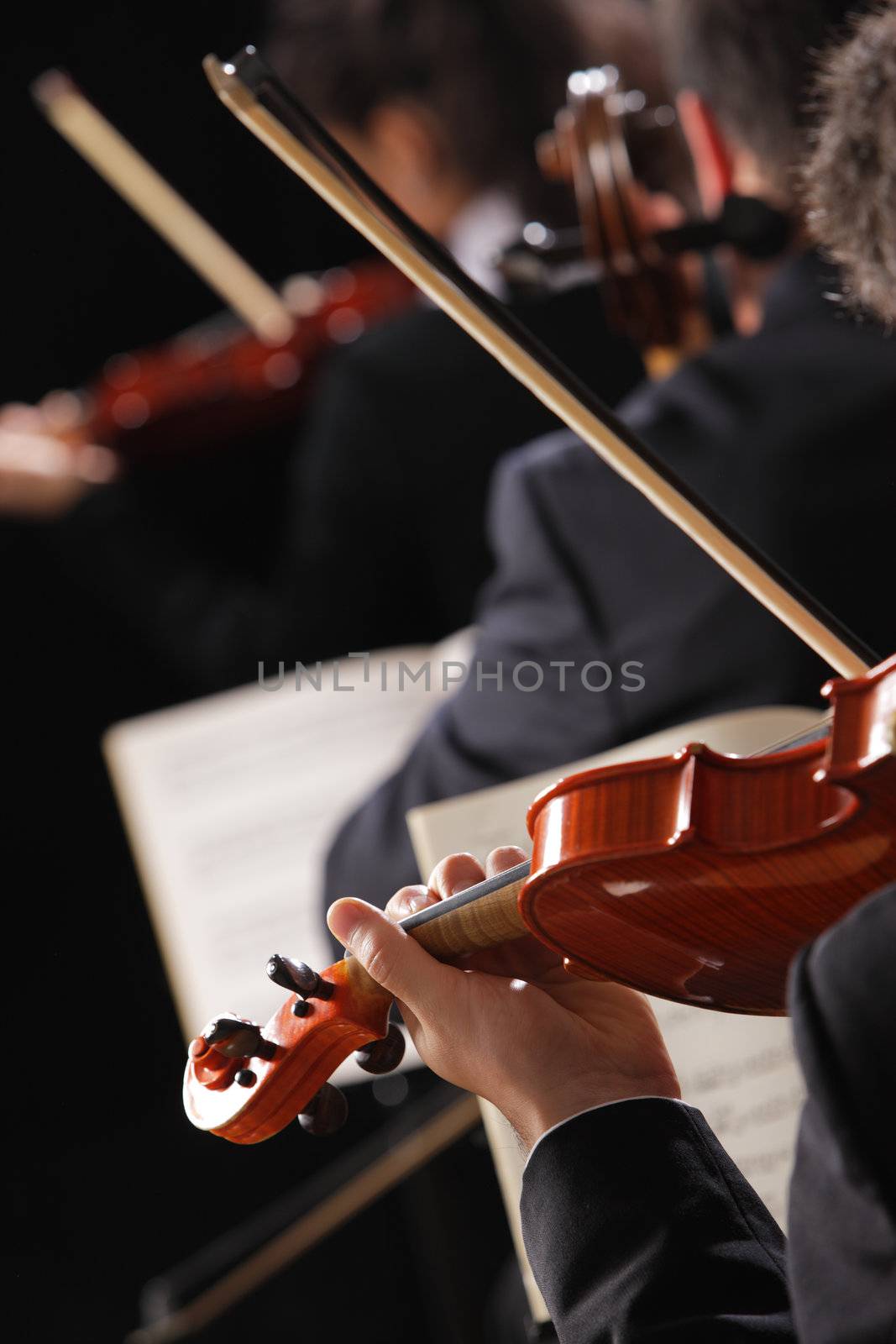 Classical music. Violinists in concert by stokkete