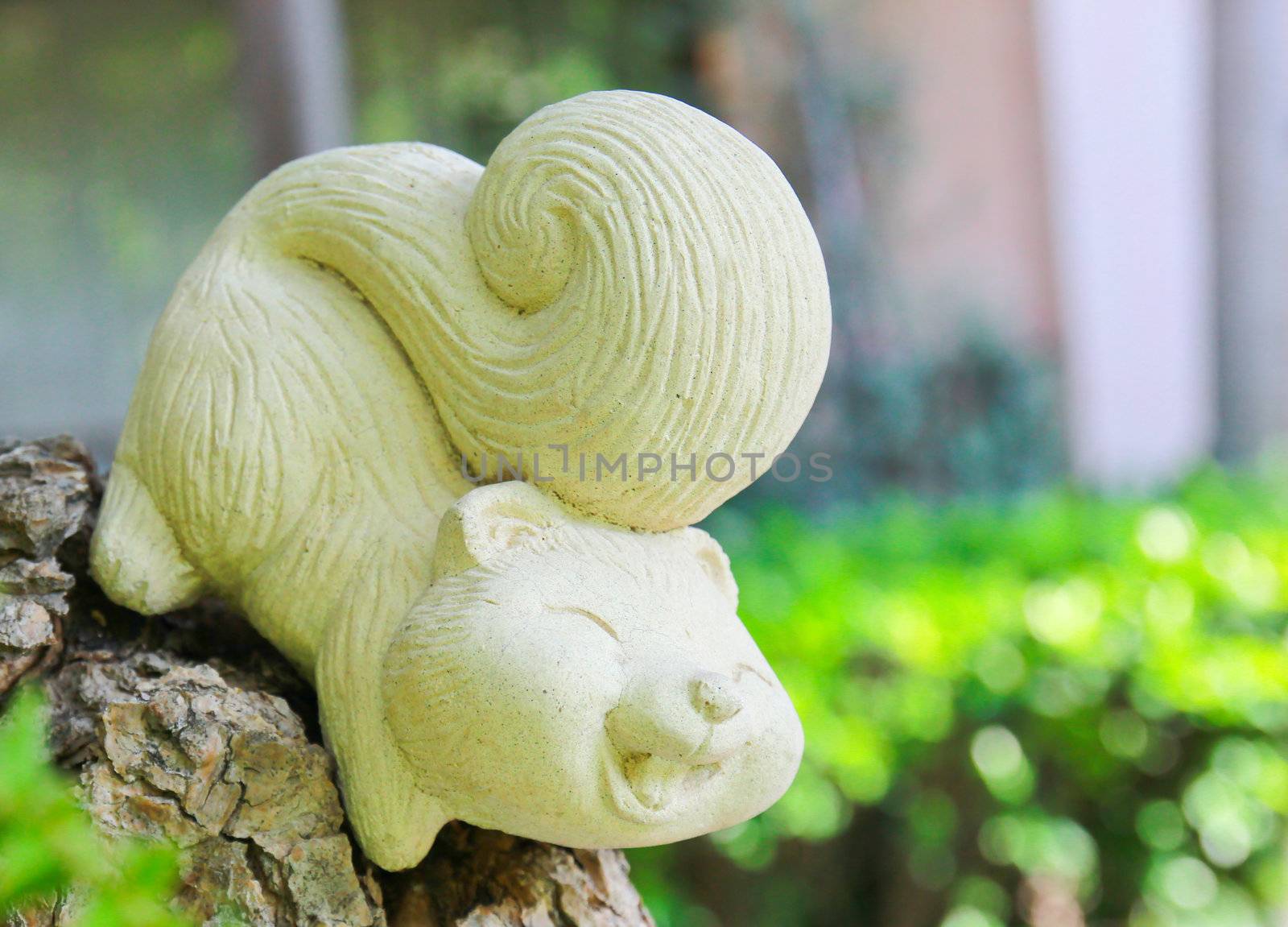 Squirrel statue in garden by nuchylee