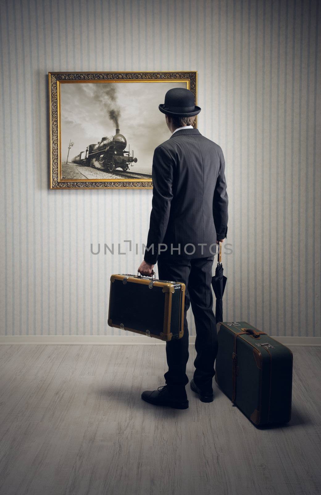 Man with suitcases waiting for the train, conceptual photo
