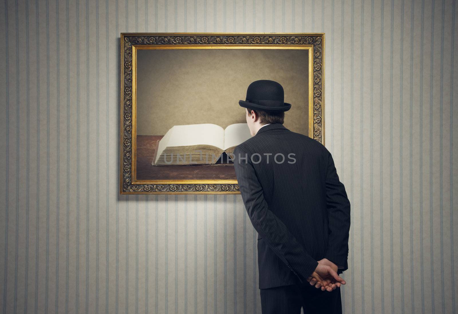 Elegant man looking at a book with blank pages