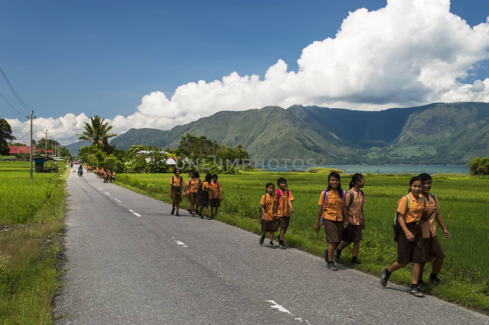 Smiling Indonesian girls on the way home from school. by GNNick