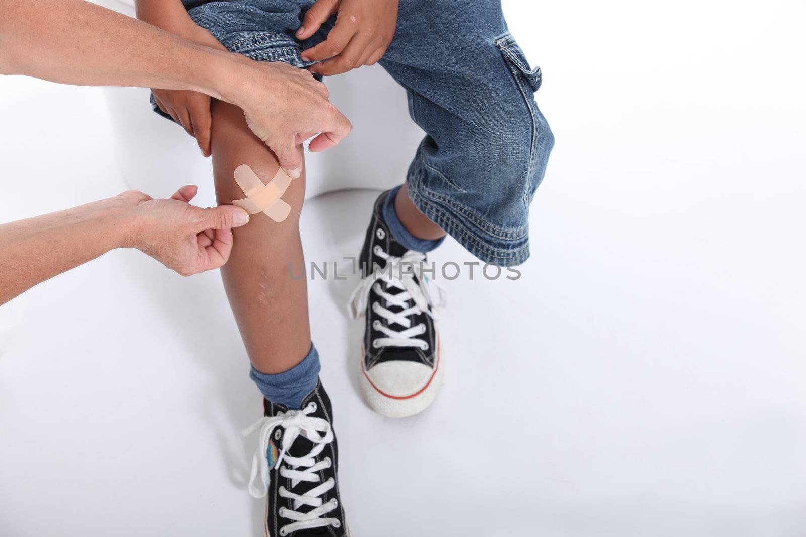 Little boy with hurt knee by phovoir