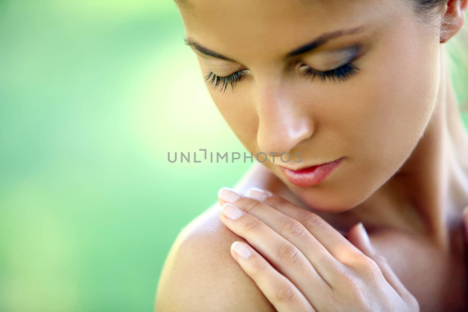 Beautiful young caucasian woman on a green background