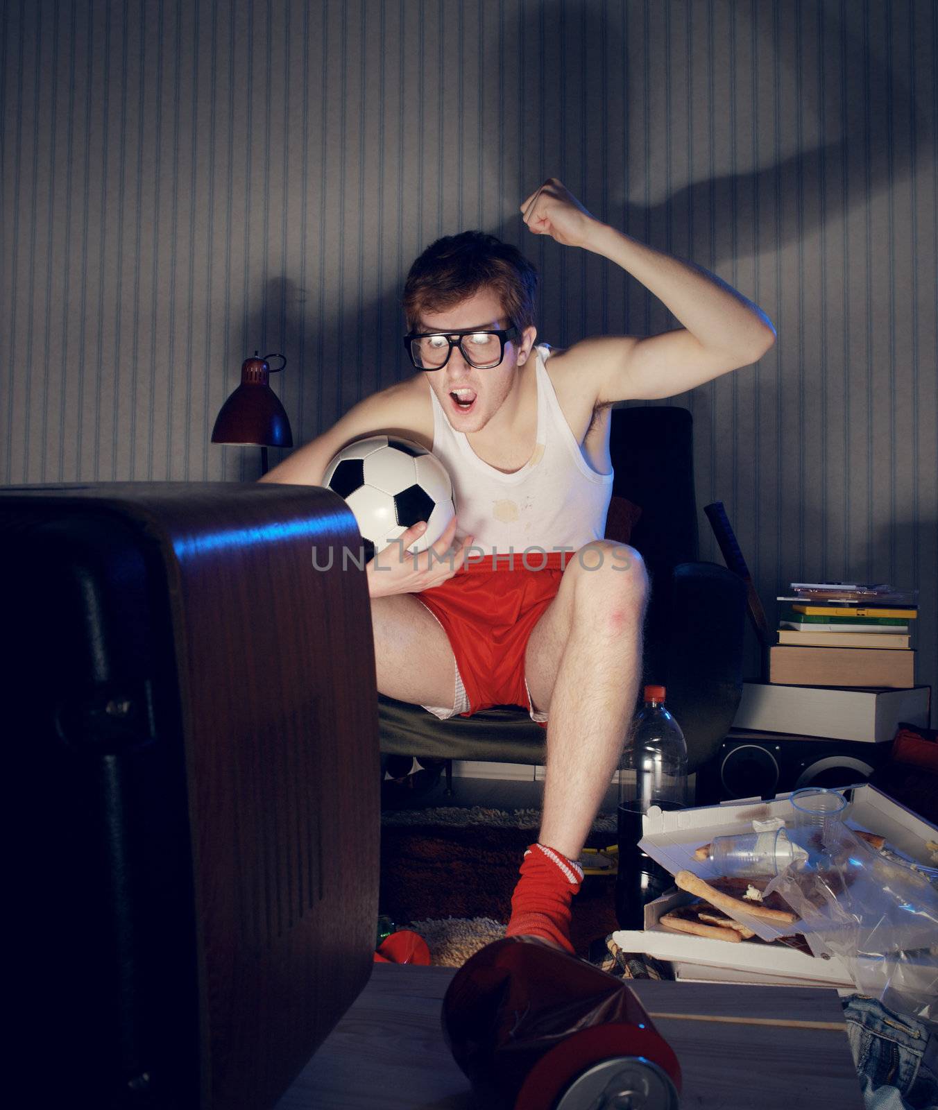Nerd boy excited by goal scored during soccer competition