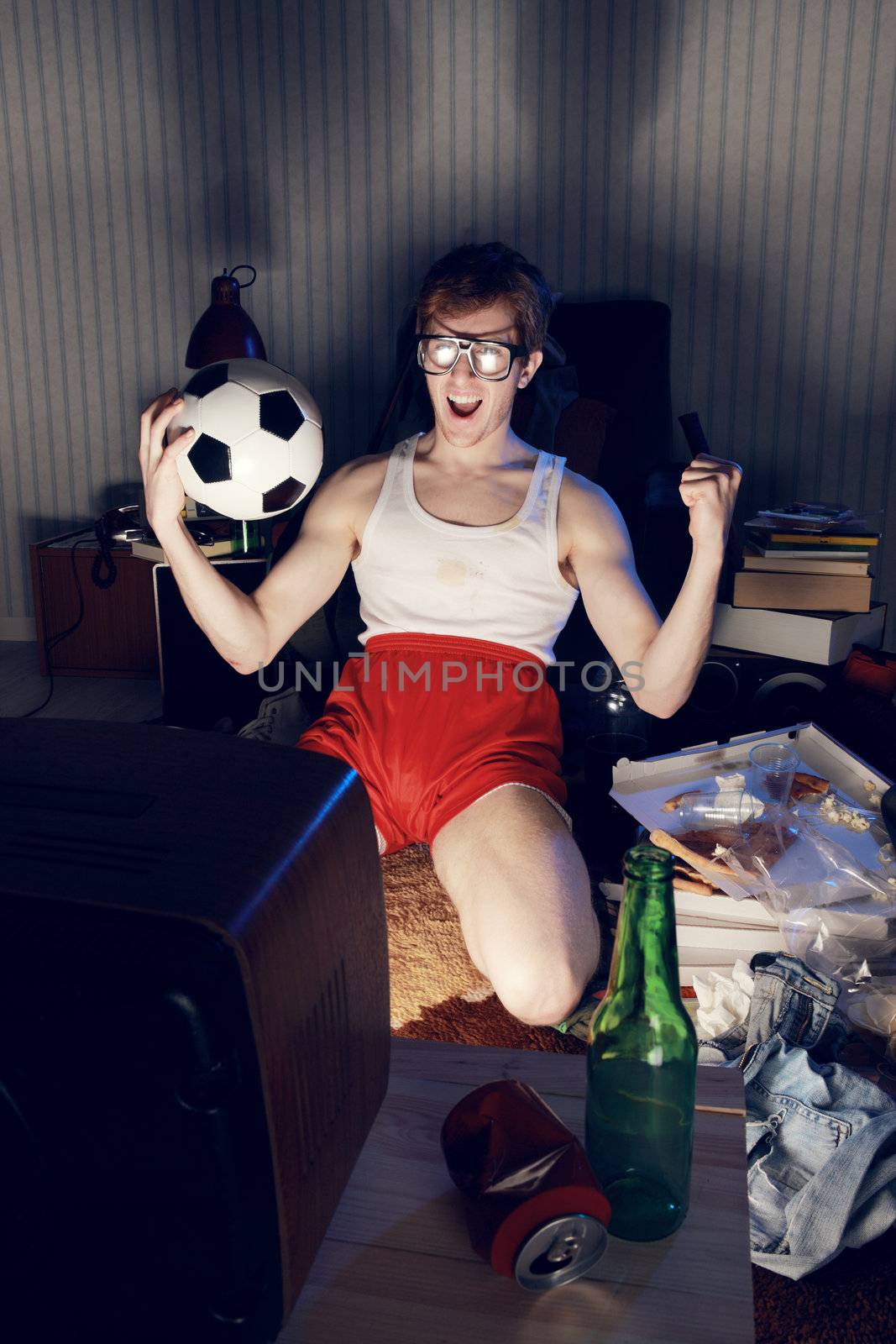 Nerd boy excited by goal scored during sports competition
