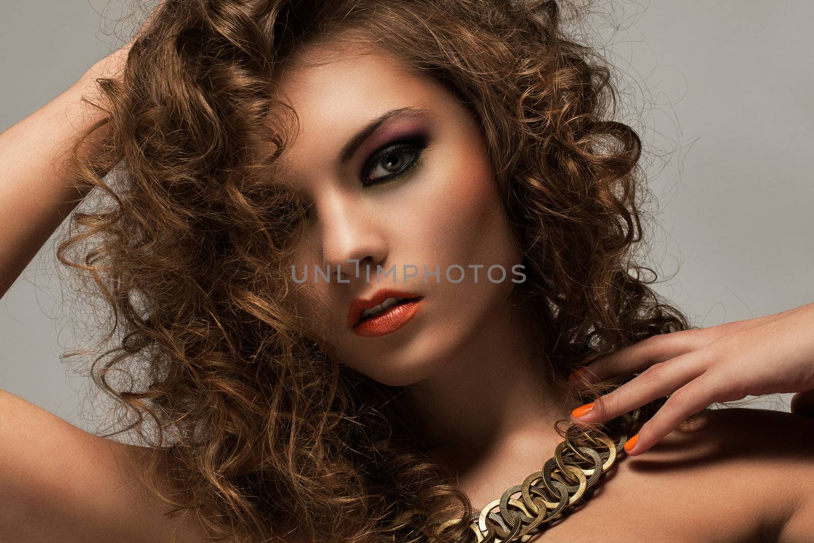 Beautiful woman with curls and makeup by rufatjumali