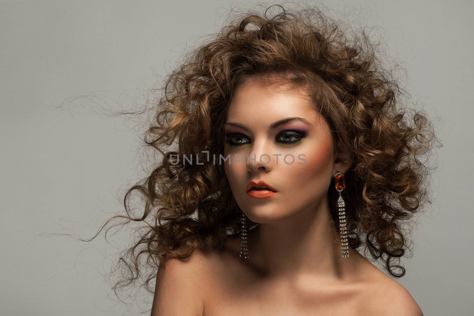 Beautiful woman with curls and makeup by rufatjumali