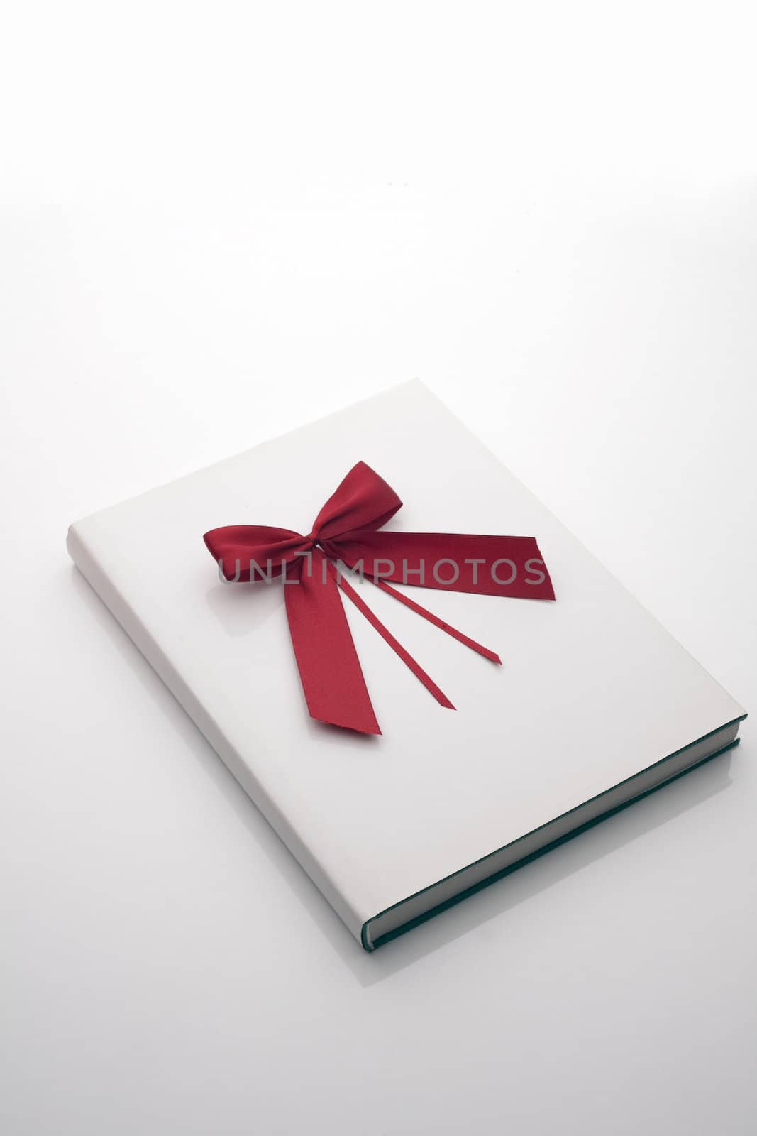 Book with red ribbon on white by ram_media_pro