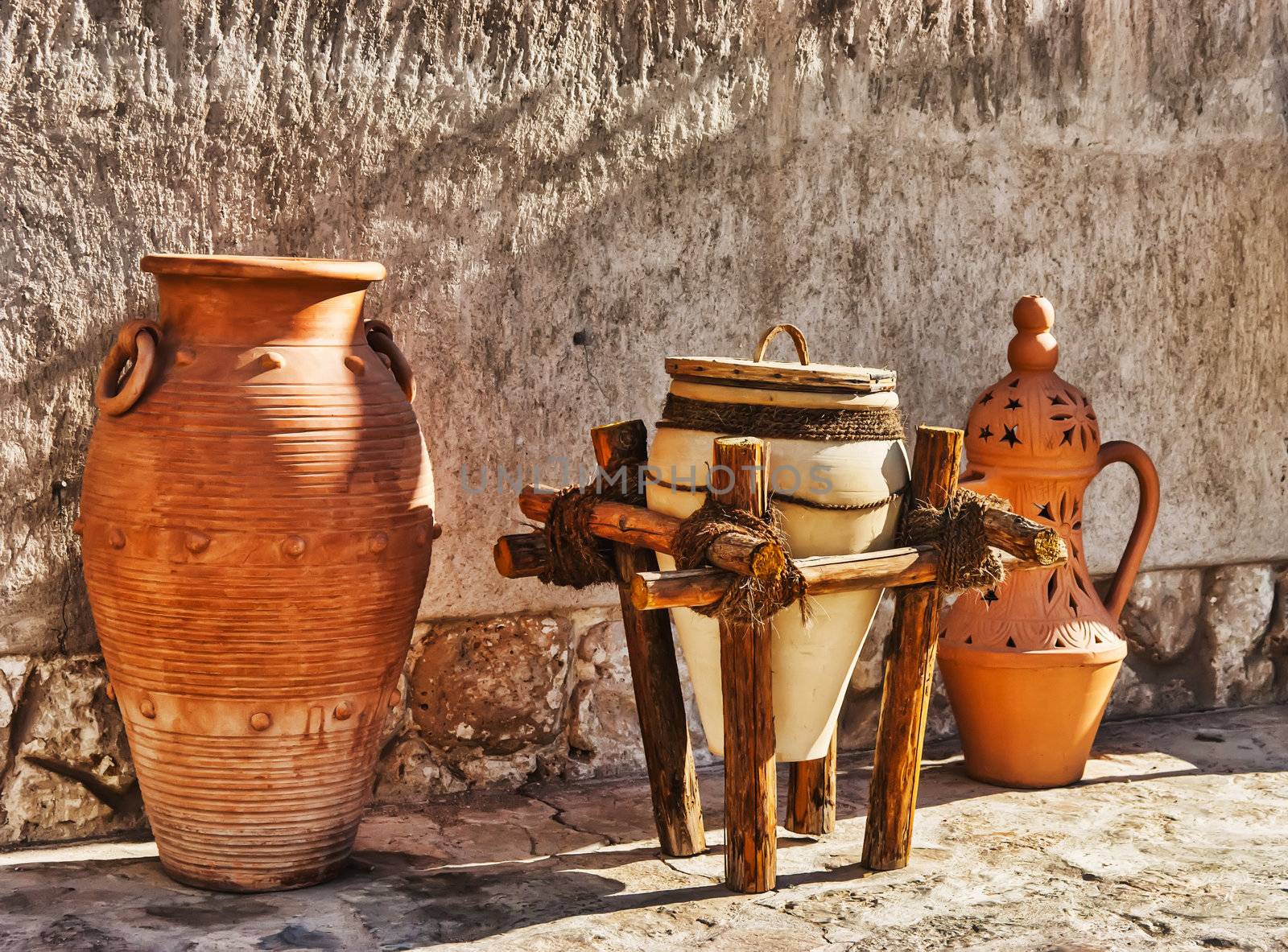 Eastern pitchers stand on a shelf in an Arab shop