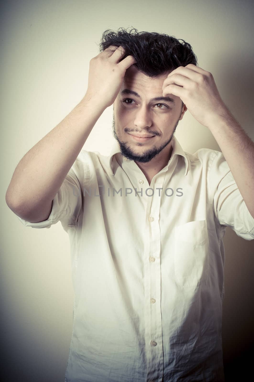 young modern stylish man on vignetting background