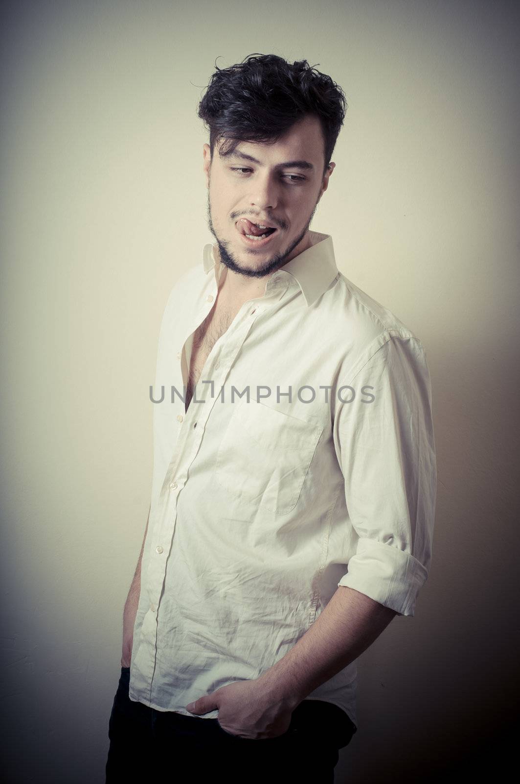 young modern stylish man on vignetting background