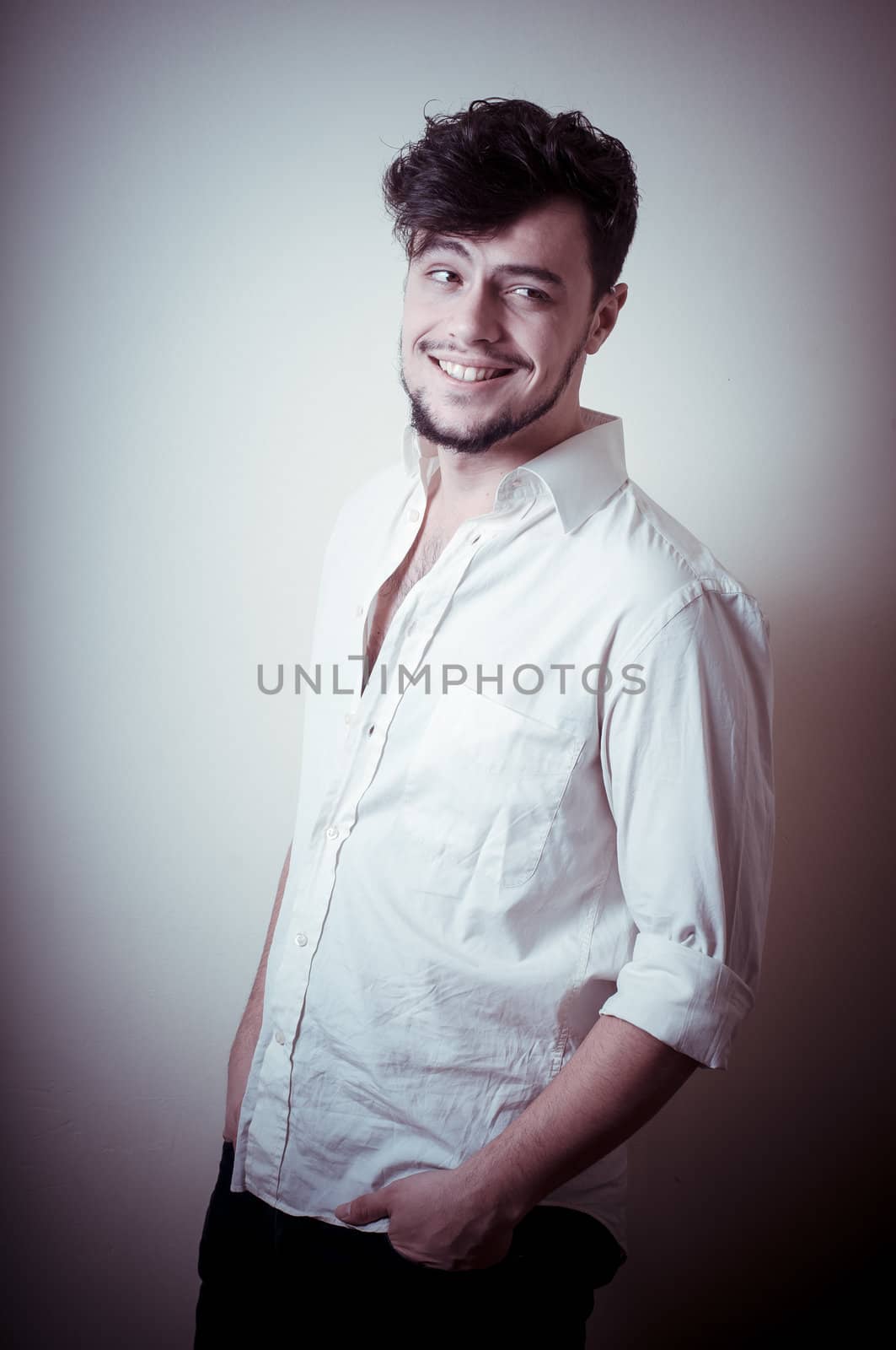 young modern stylish man on vignetting background