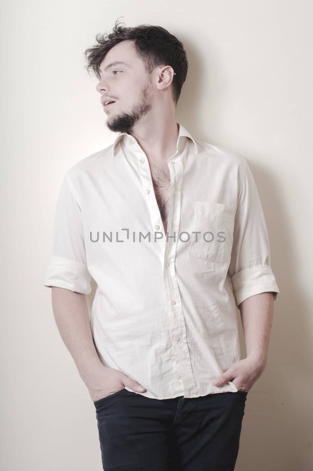 young modern stylish man on vignetting background