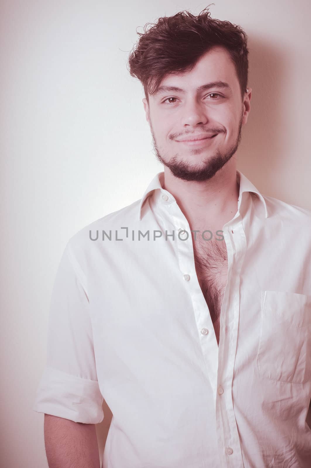 young modern stylish man on vignetting background