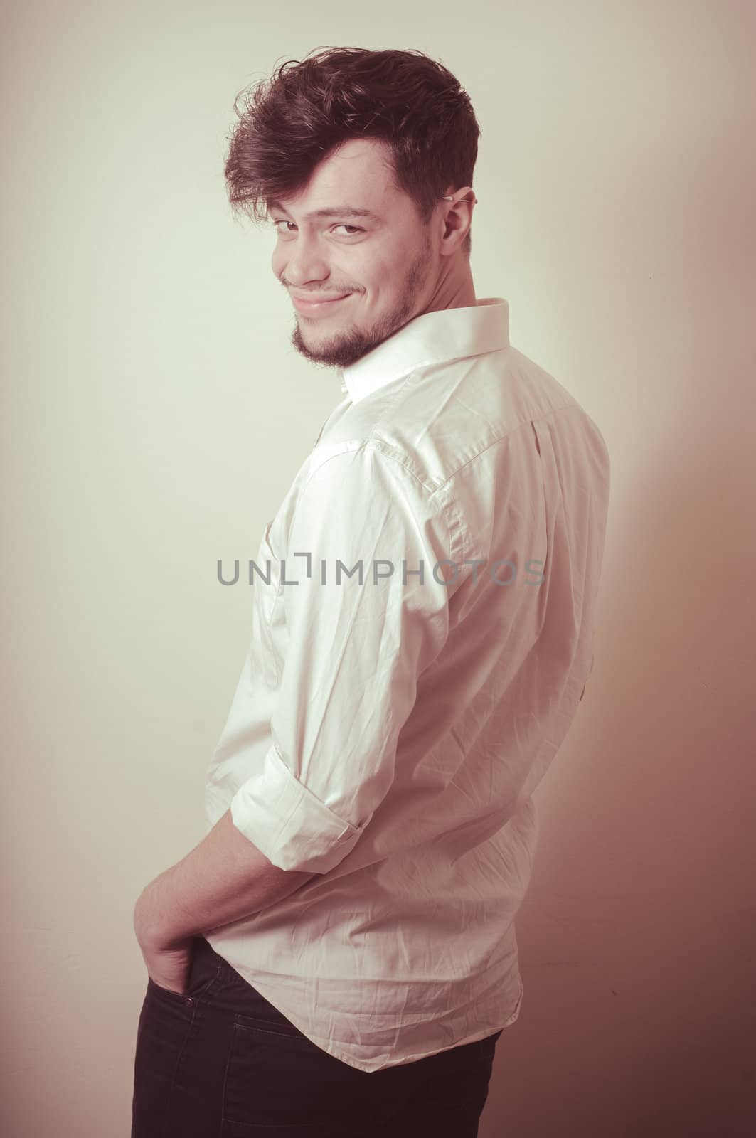 young modern stylish man on vignetting background