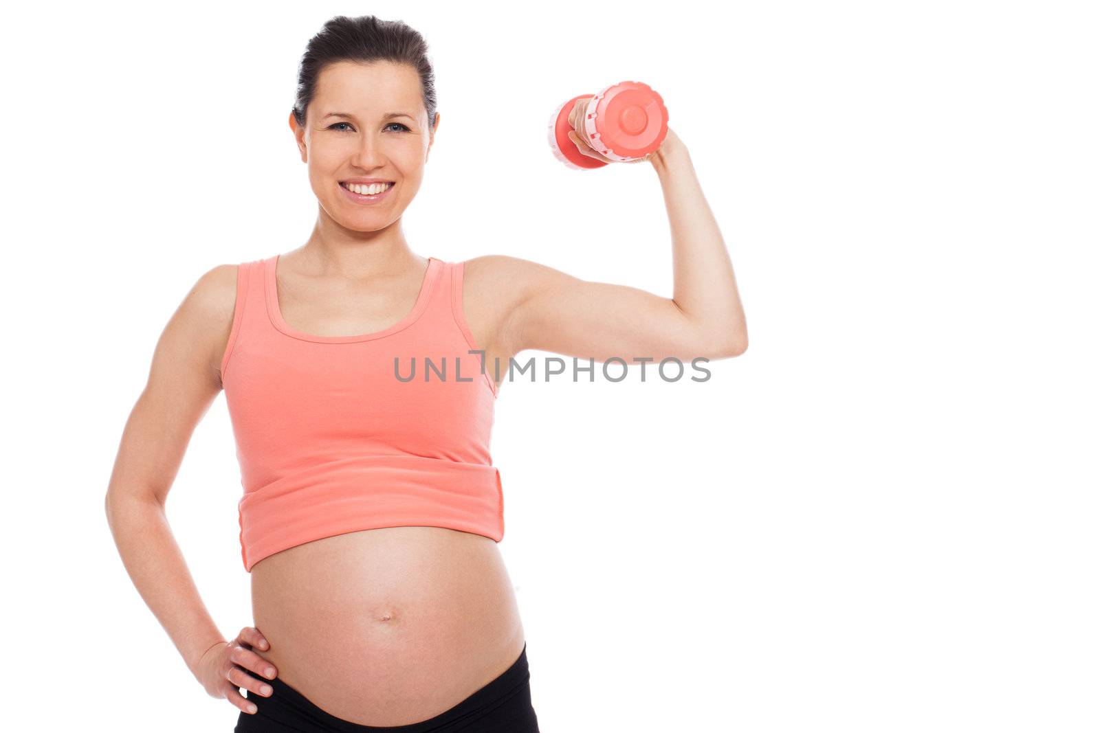 Beautiful pregnant woman working out with dumbbells isolated over white background