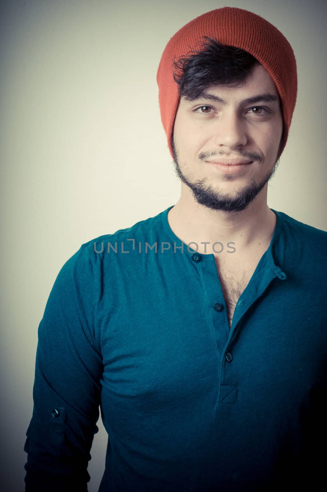 young modern stylish man on vignetting background
