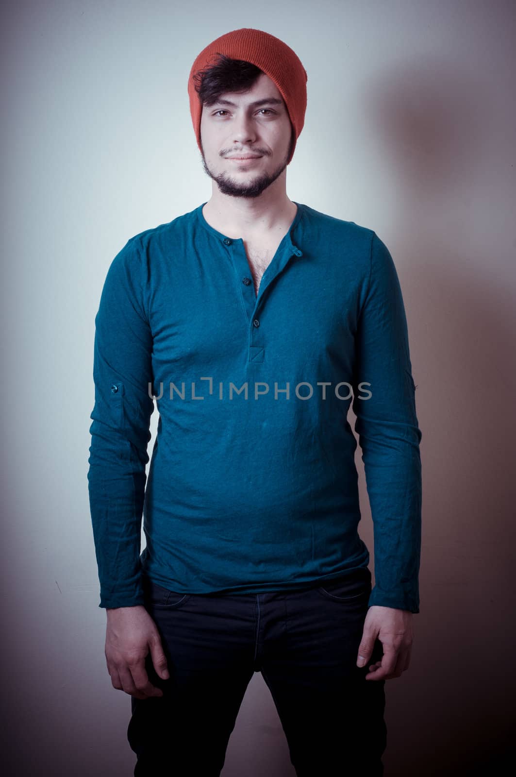 young modern stylish man on vignetting background