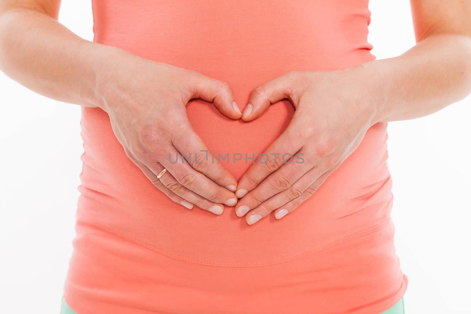 Beautiful pregnant belly on a white background