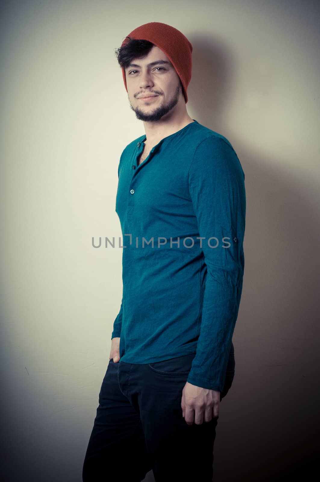 young modern stylish man on vignetting background