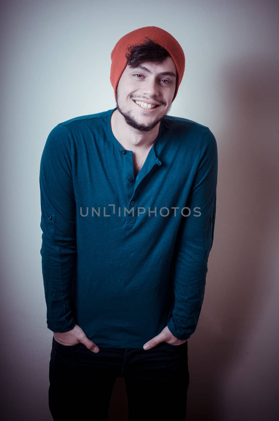 young modern stylish man on vignetting background