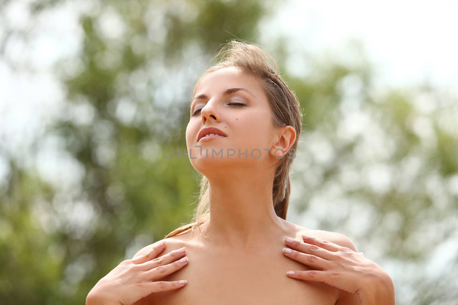 Beautiful caucasian woman enjoys summer sunny outdoors