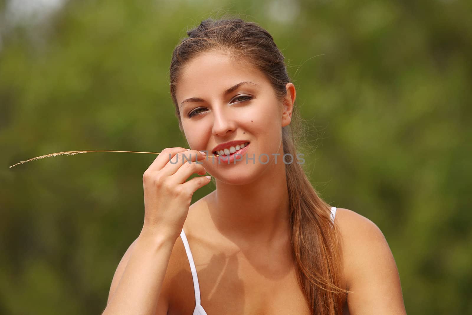 Beautiful caucasian woman enjoys summer sunny outdoor