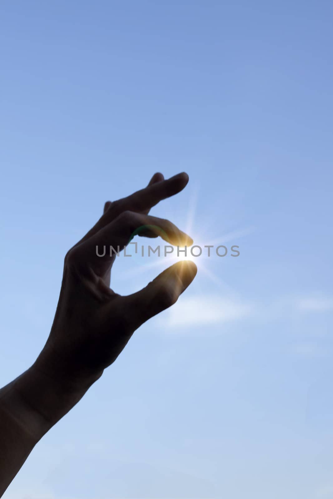 Finger holding sun by ram_media_pro