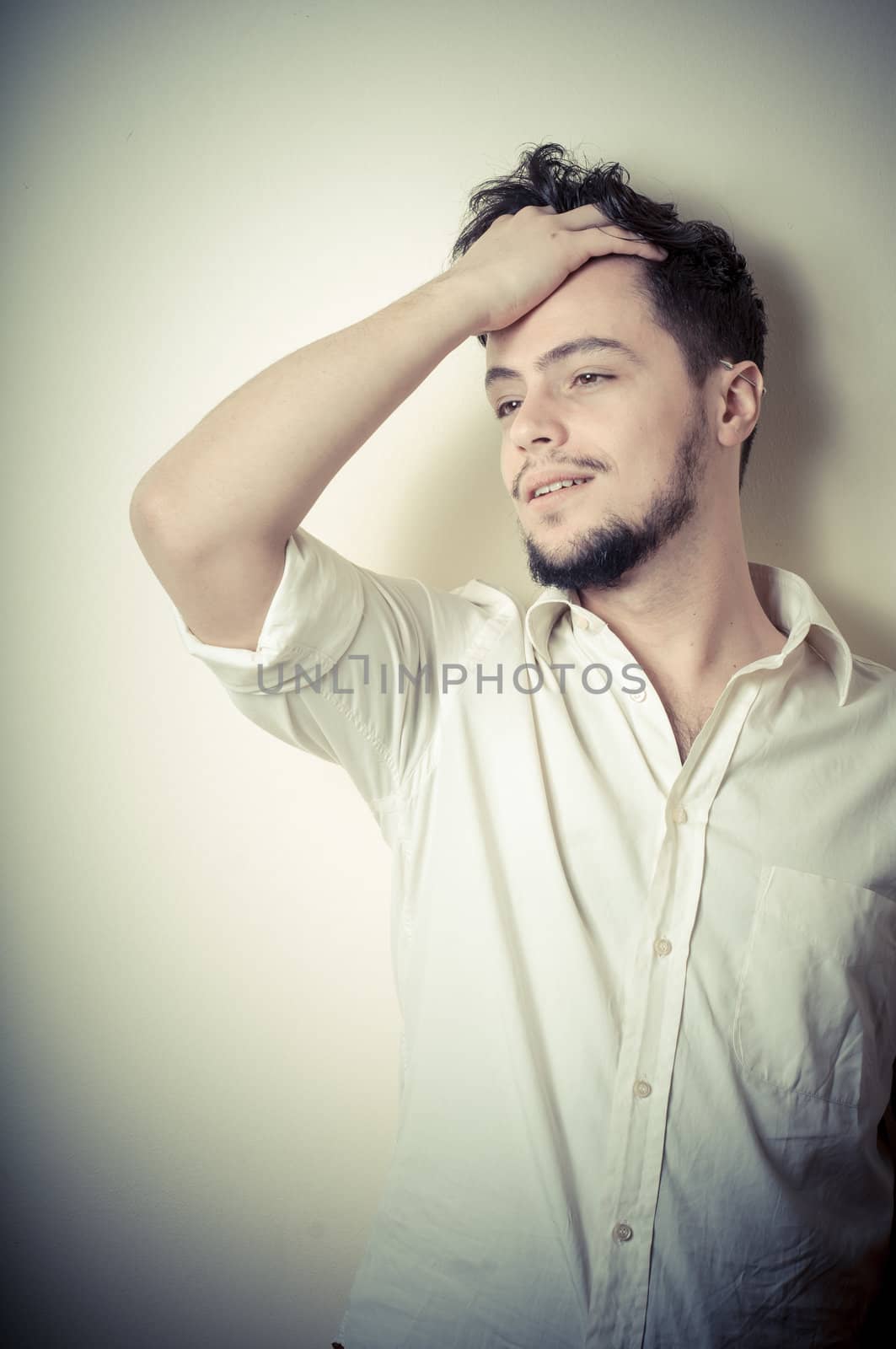young modern stylish man on vignetting background