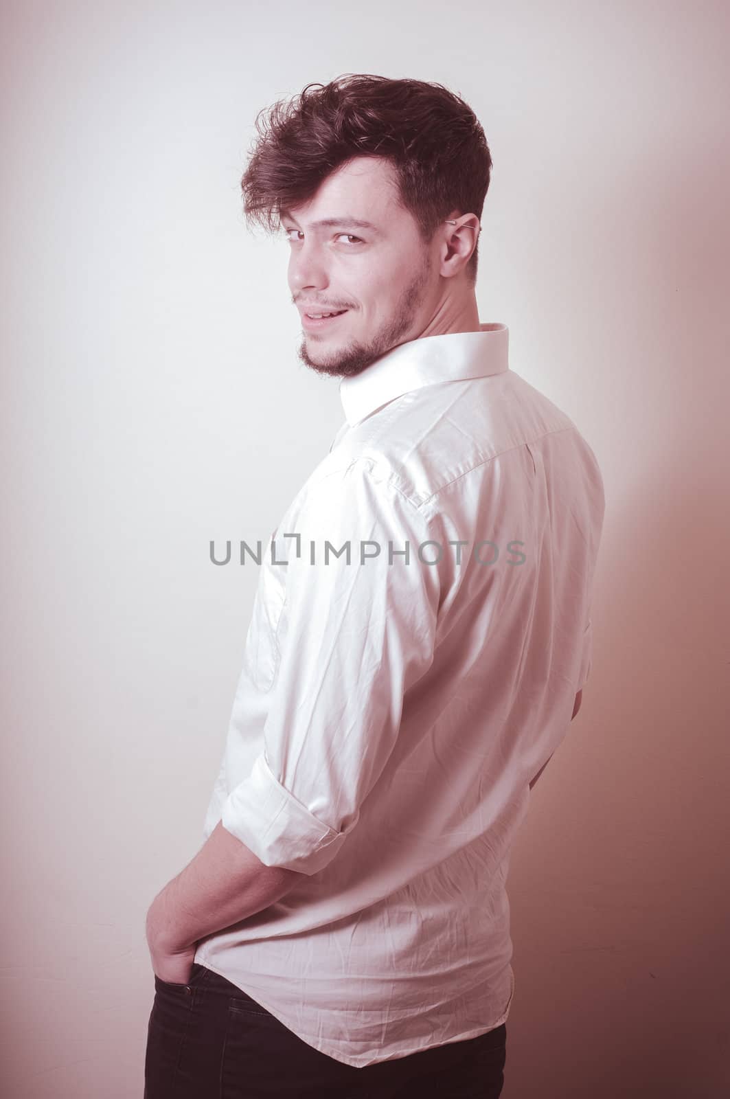 young modern stylish man on vignetting background