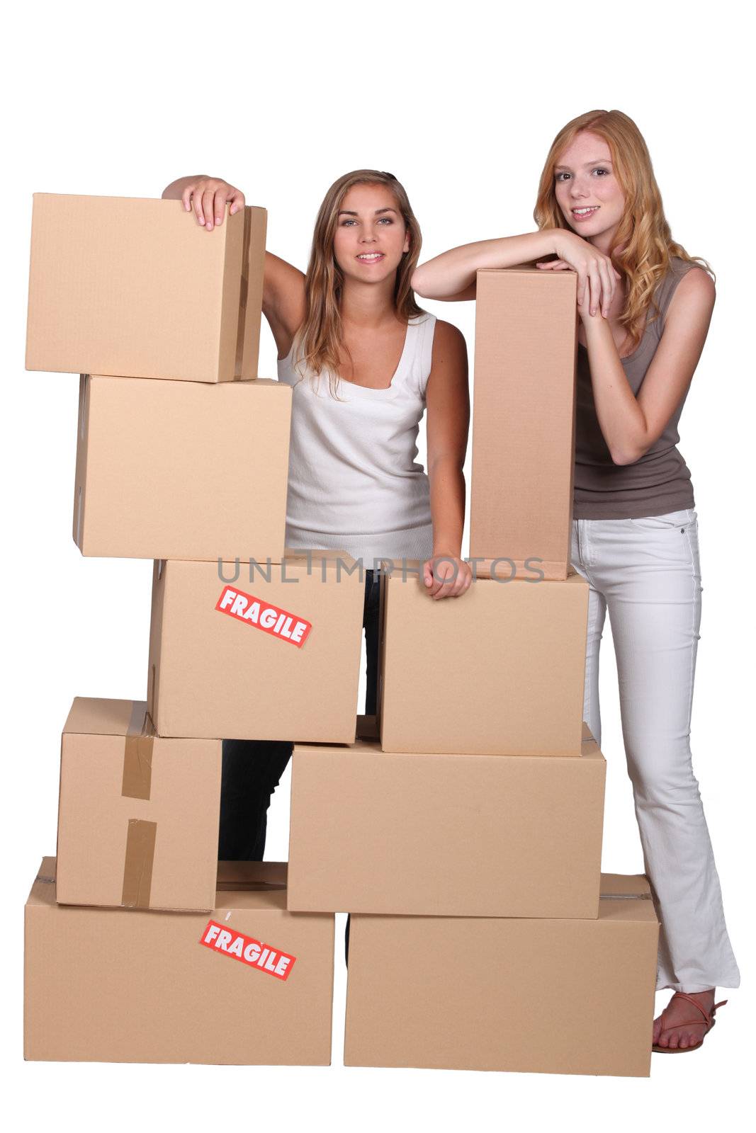 Girls surrounded by boxes by phovoir