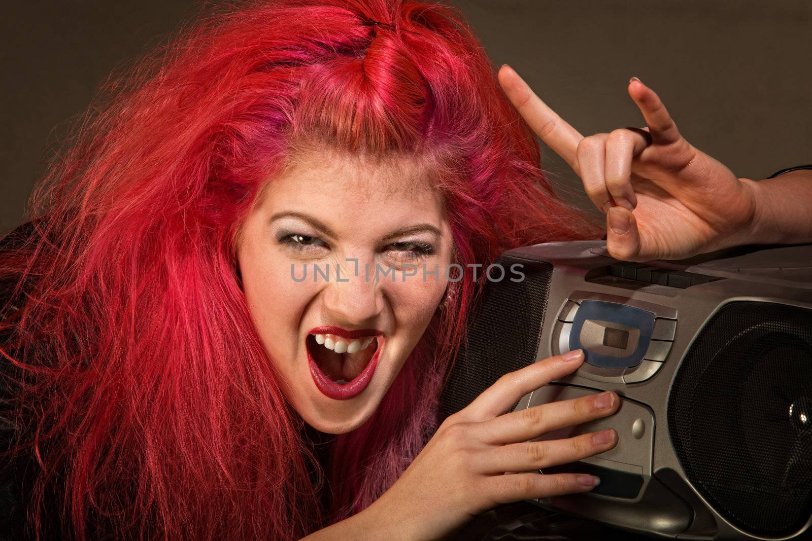 Yelling young woman with pink hair and radio