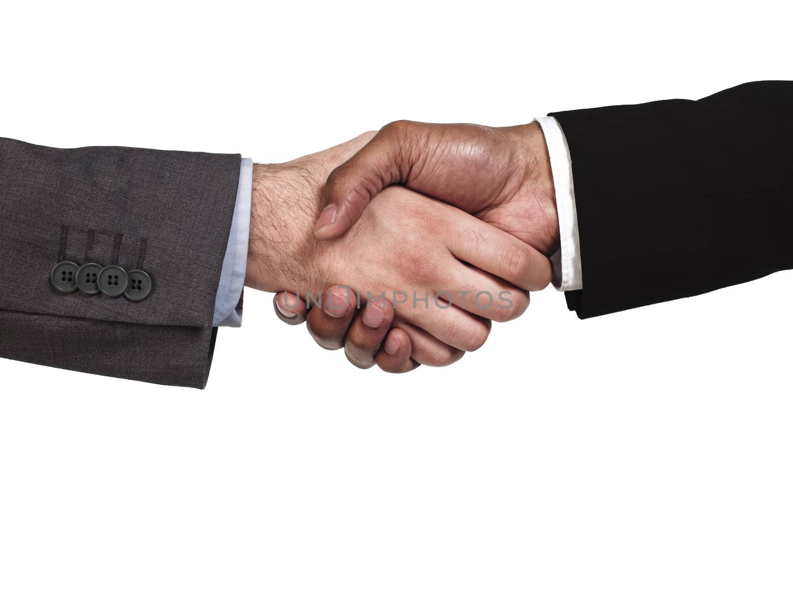 Close-up of business colleagues shaking hands on white background, Model: Kareem Duhaney