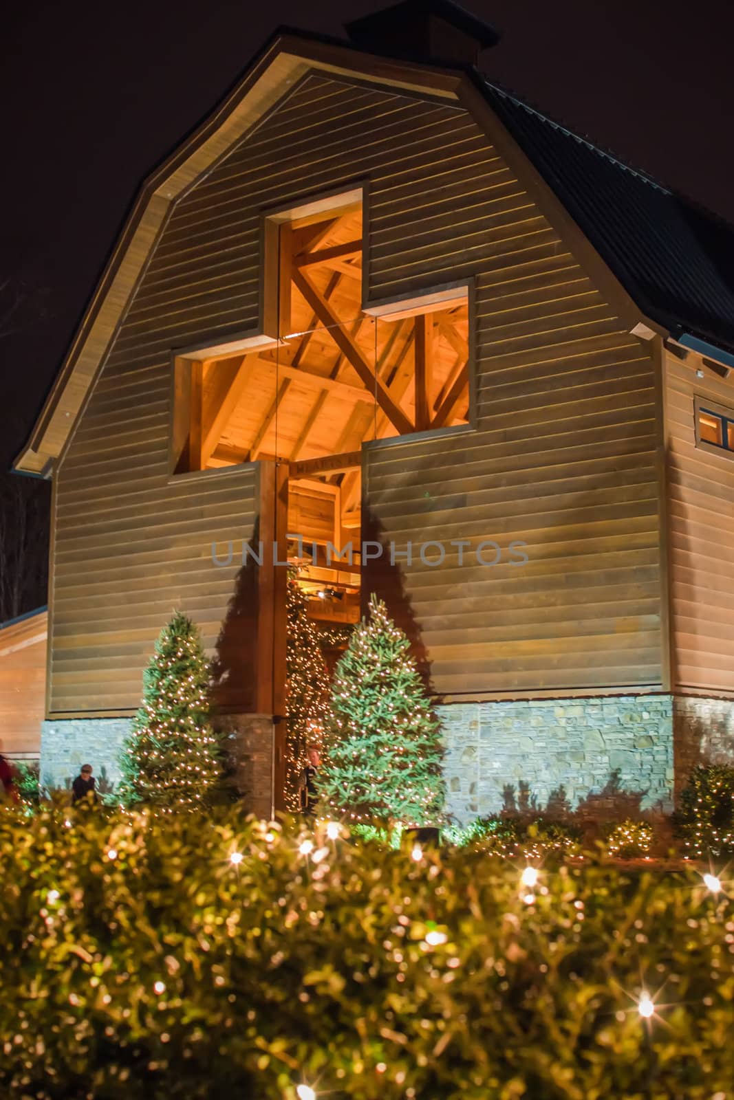 architectural cross at a village decorated for christmas time